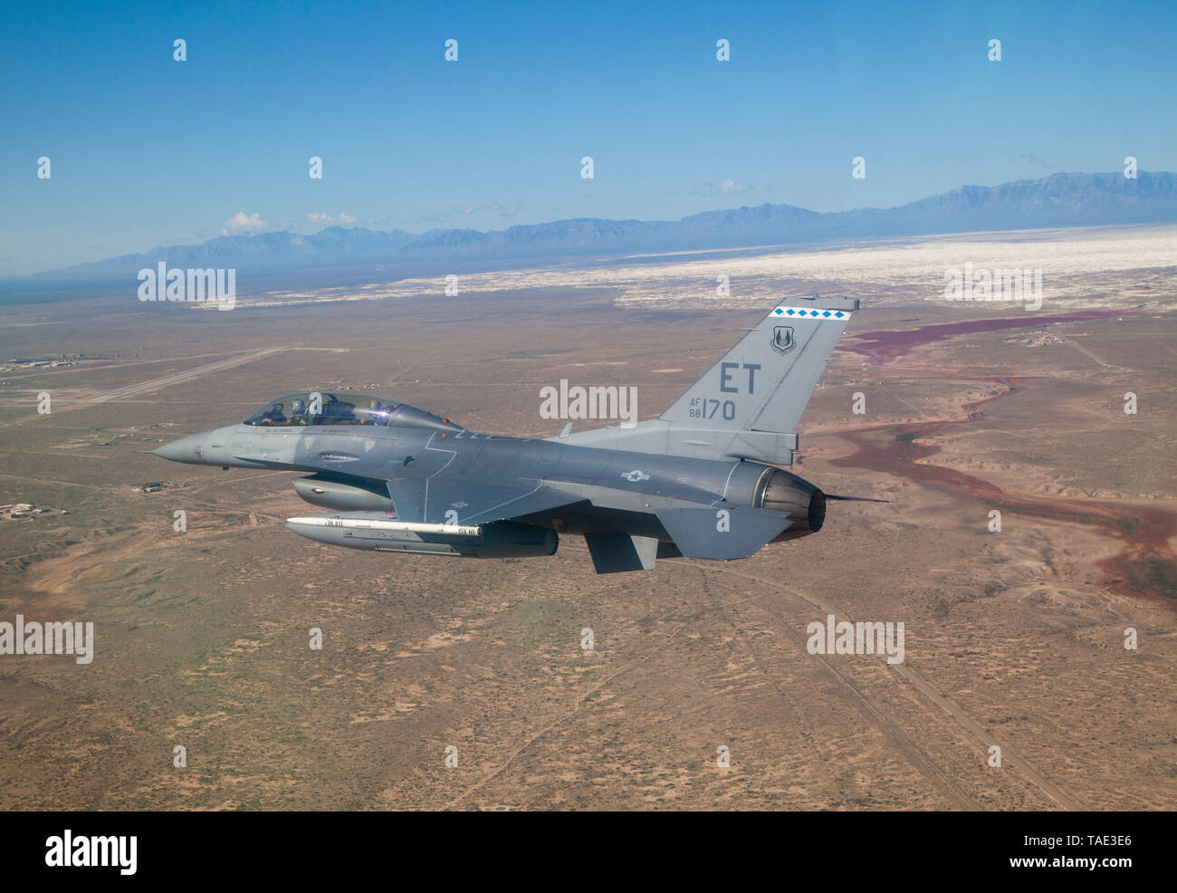 Capt. Spencer 'Memphis' Bell, 40th Flight Test Squadron Pilot and Tech. Sgt. John Raven, 40th FLTS Photographer fly near White Sands National Monument near Holloman Air Force Base, New Mexico, Apr. 24, 2019. This was the first time this AIM-9X was used against a QF-16.  (U.S. Air Force photo by Mr. Don Allen) Stock Photo