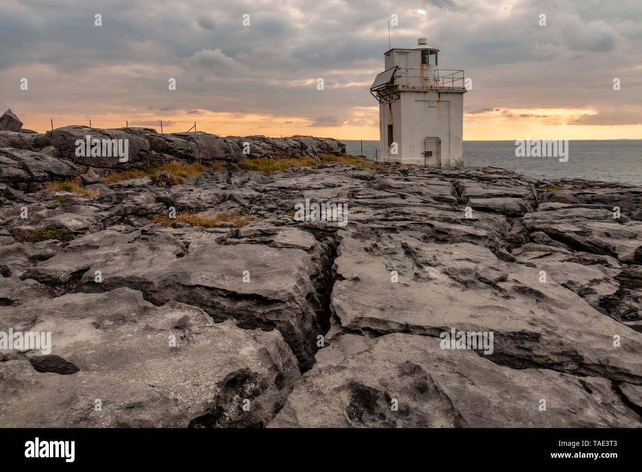 Black Head lighthouse and limestone pavement, Burren, County Clare, Ireland Stock Photo