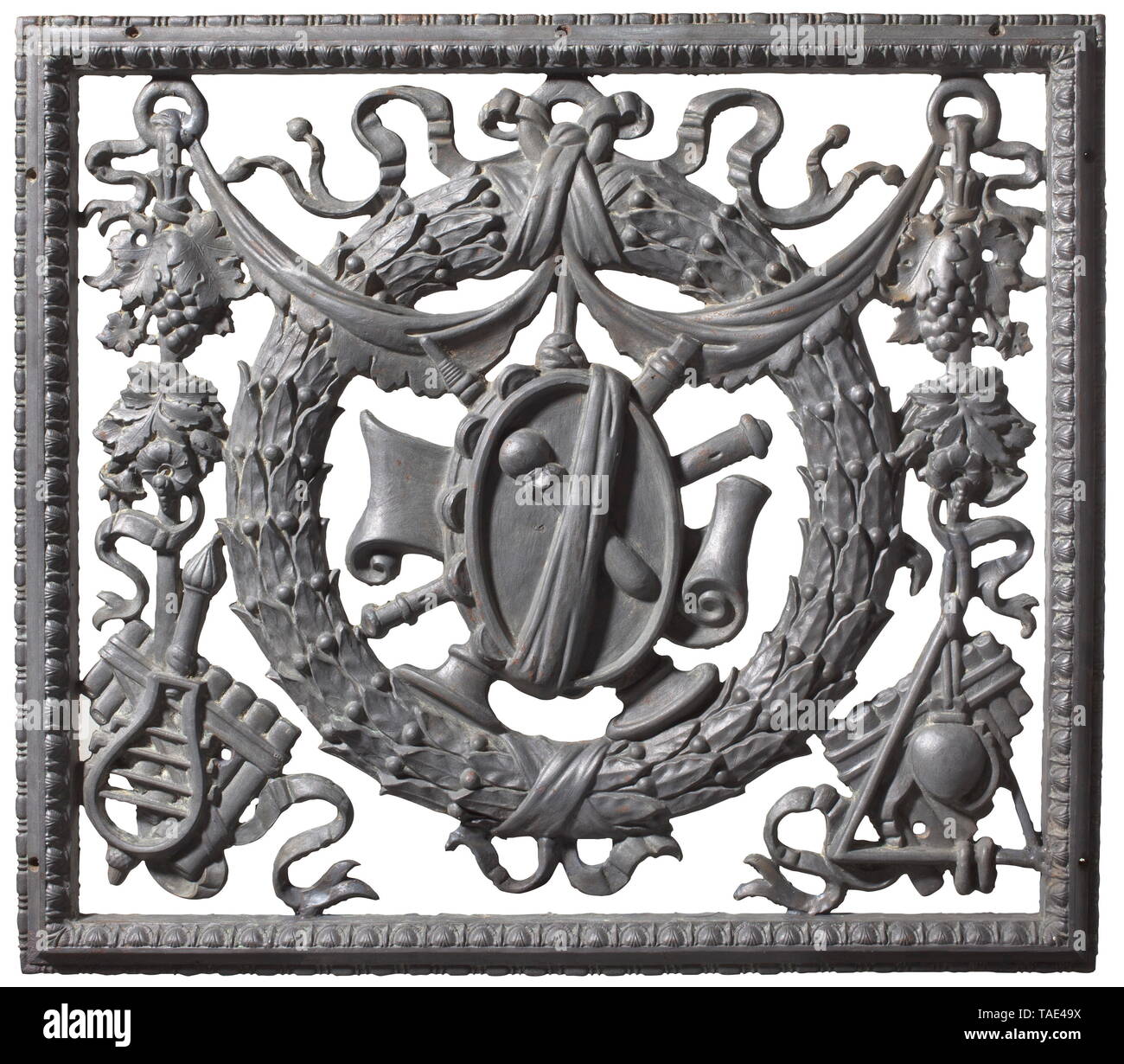 A German decorative grille, cast iron with musical instruments motif, circa 1880 Openwork cast rectangular grille with framing in relief. Drum with drumstick depicted in the centre, surrounded by wind instruments and laurel wreath. In the lower corners pan flutes amidst scrollwork and tendril decoration. Dimensions 74 x 84 cm. historic, historical, 19th century, Additional-Rights-Clearance-Info-Not-Available Stock Photo