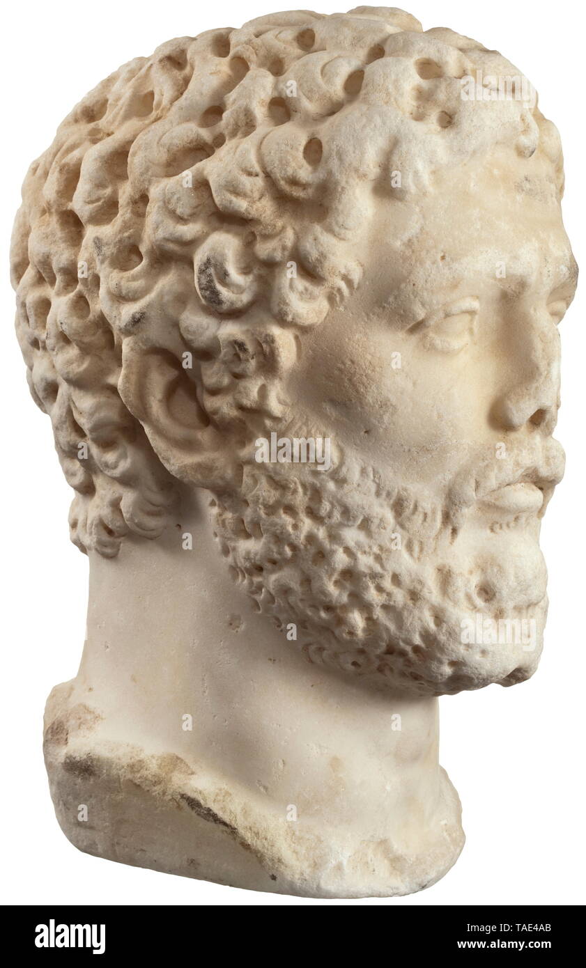 A Roman private portrait from the age of Septimius Severus - a fine marble copy from the 19th century patterned after an ancient model A male head with a closely-cropped beard of wavy locks terminating at bottom in two points. Head worked like a component for a bust, but evenly ground at the sides and bottom of the neck. The underside of the head slightly slanted to the left. Hair, beard and edges of the neck slightly over-ground. Nose tip broken off. The surface appears to have been deliberately processed to create the impression of an ancient s, Additional-Rights-Clearance-Info-Not-Available Stock Photo