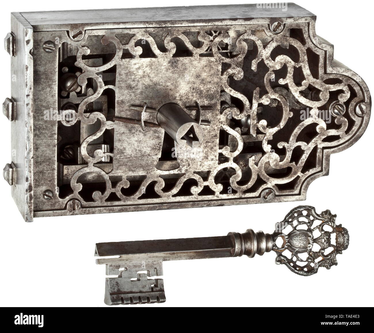 An intricate French lock, 17th century Wrought iron. The lock mechanism with three cut locking bolts, each of which can be moved individually by a complicated system of wheels and pins. Openwork interior fittings, smooth exterior surface with ornamental bosses and openwork front plate. Comes with a matching key. Dimensions 103 x 195 x 80 mm. Finely worked lock of superior quality. historic, historical, handicrafts, handcraft, craft, object, objects, stills, clipping, clippings, cut out, cut-out, cut-outs, 17th century, Additional-Rights-Clearance-Info-Not-Available Stock Photo