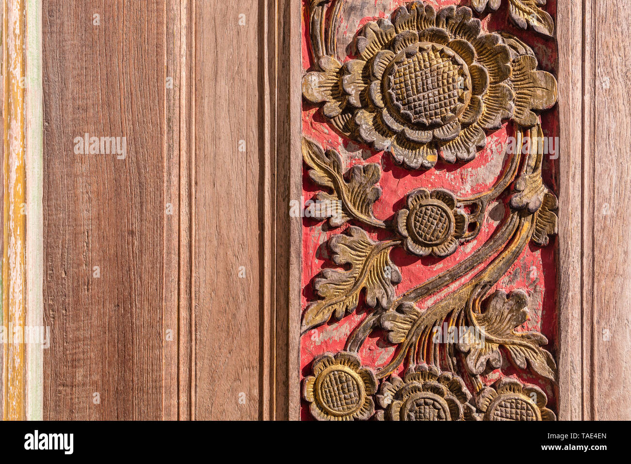 Carved wooden doors of Balinese house, Bali, Indonesia. With space on the left side. Stock Photo