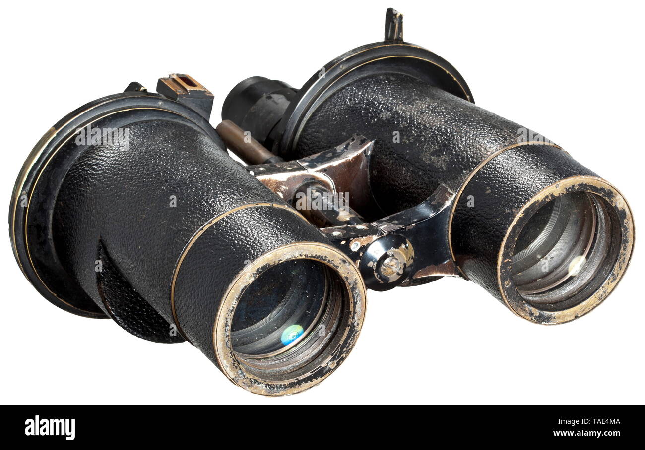 Carl Zeiss binoculars DF 8 x 60, 'Deck mounted' Wide-angle binoculars of the Kriegsmarine with optical peak performance, mainly used for nighttime observation onboard submarines. Black painted with a partial imitation leather covering, applied brass discs with built-in glass filter 'Ohne Glas - Klar - Sonne - Scheinwerfer' changeable via an exterior lever, marked with among others an engraved serial number '1894679', 'T' (=transparent coating), naval acceptance and 'N 17'. Extensible sun shield, dovetail groove with amber-coloured filter glass for optional added illuminatio, Editorial-Use-Only Stock Photo