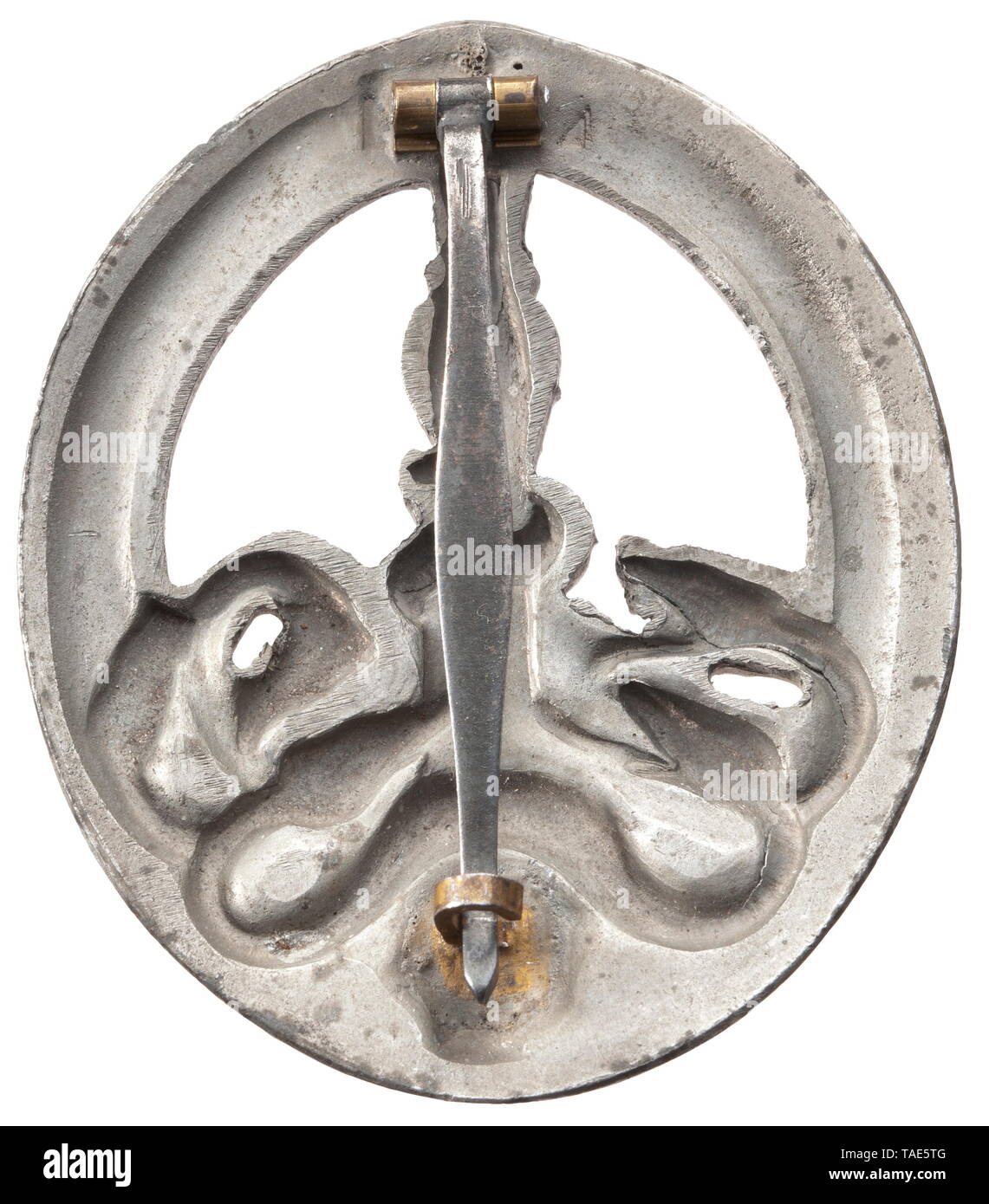 An Anti-Partisan Badge in Bronze Half-hollow zinc issue of maker Juncker, Berlin (bronzing almost completely gone). Two cutouts, magnetic attachment pin and clasp. Unquestionable original with typical factory tool marks. Height 60 mm. Weight 34 g. historic, historical, 20th century, Additional-Rights-Clearance-Info-Not-Available Stock Photo