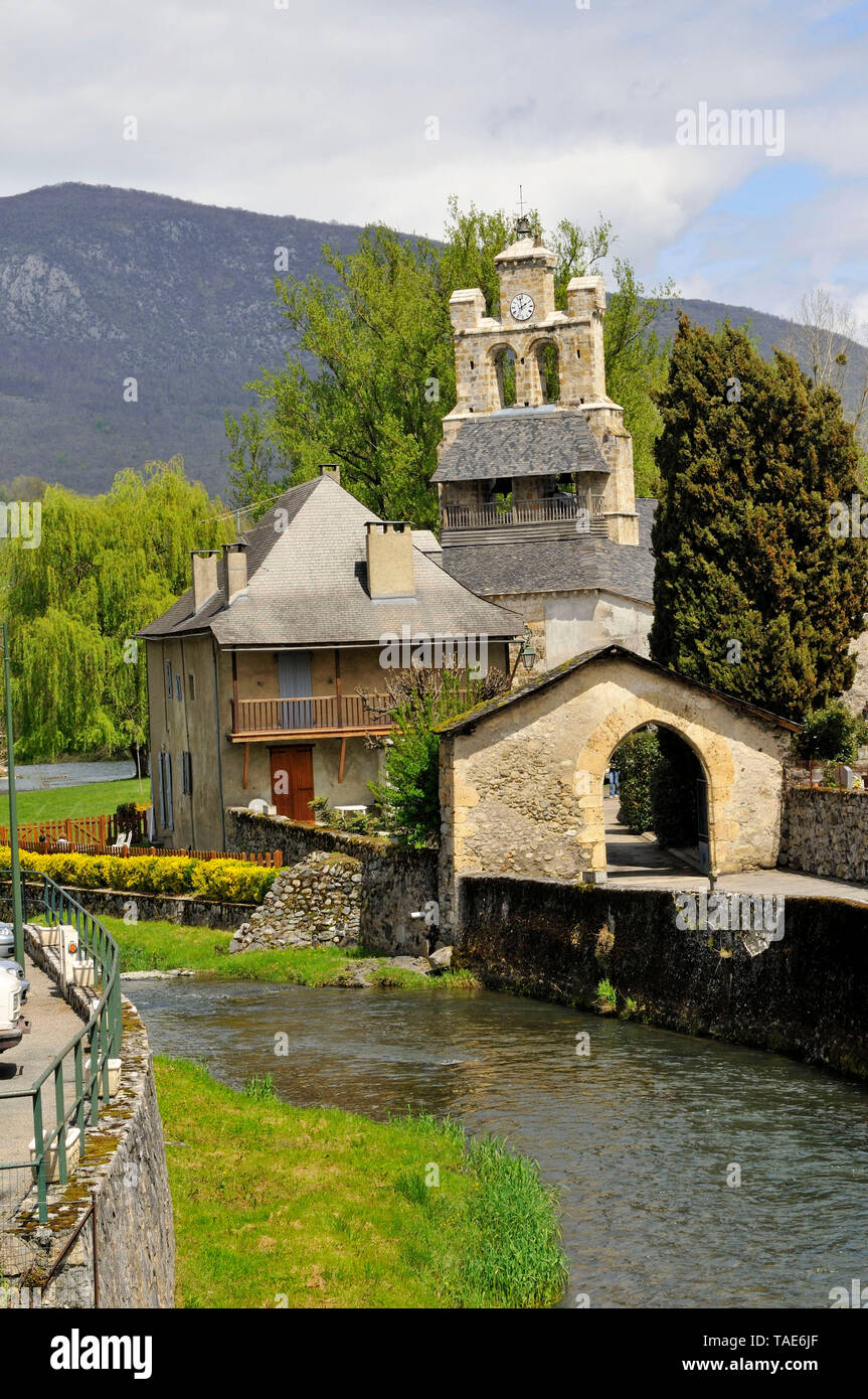 Village of Audressein and Church of Notre-Dame de Tramezaygues on the banks of the Bouigane river, Couserans area, in the Ariege department Stock Photo