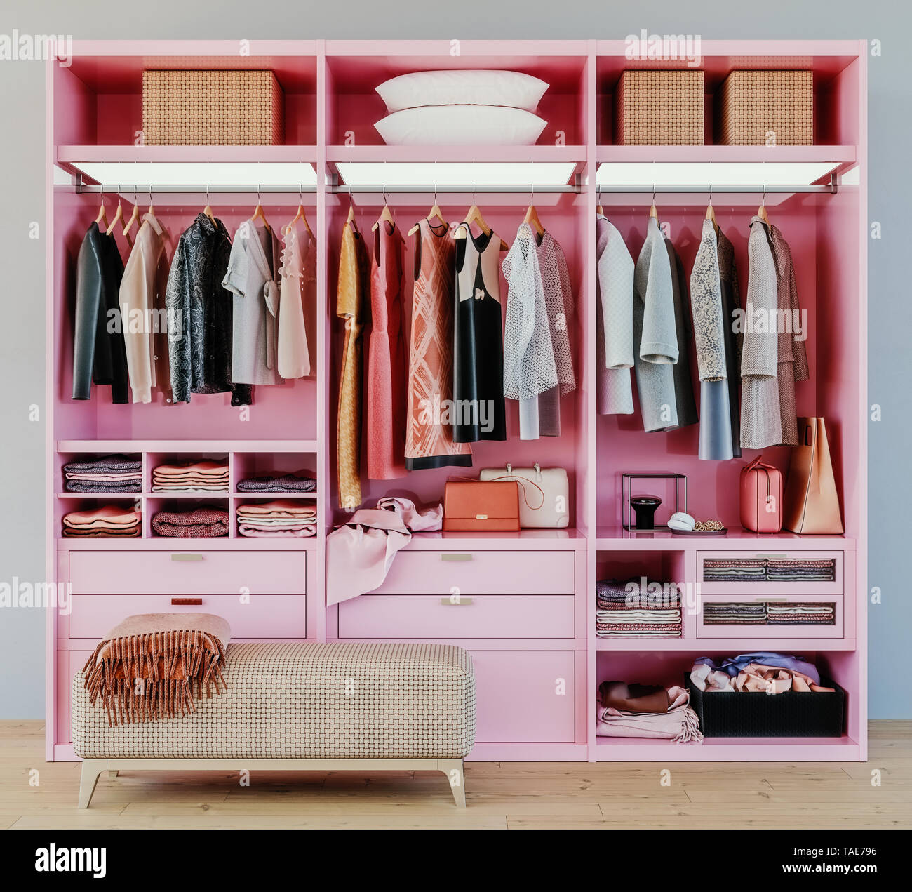 modern pink wardrobe with clothes hanging on rail in walk in closet design interior, 3d rendering Stock Photo