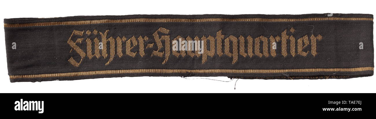 A cuff title 'Führer-Hauptquartier' 1st model Black band with gold-woven Gothic inscription (with hyphen) and edging. A used cuff title circa 40 cm in length. This title was worn by all inner staff members of the Führer's headquarters established in 1939. The 2nd model was introduced in 1941. An extremely rare cuff title. historic, historical, 20th century, Editorial-Use-Only Stock Photo
