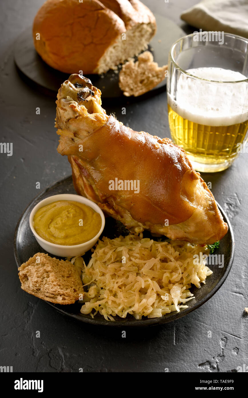 Oven baked pork knuckle (eisbein) with braised cabbage (sauerkraut) and
