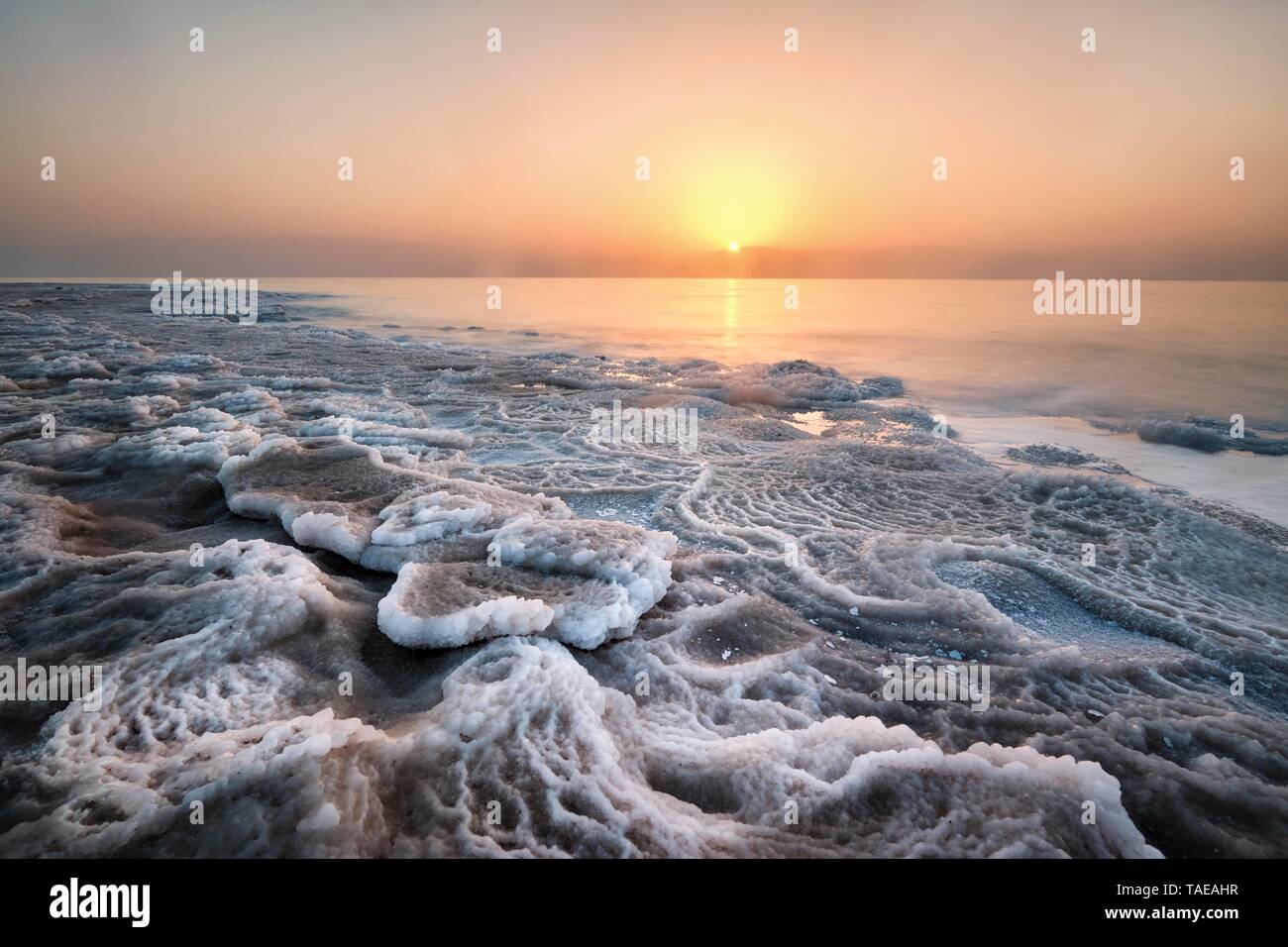 Shore with deposited salt crust, sunset at the Dead Sea, West Bank, Israel Stock Photo