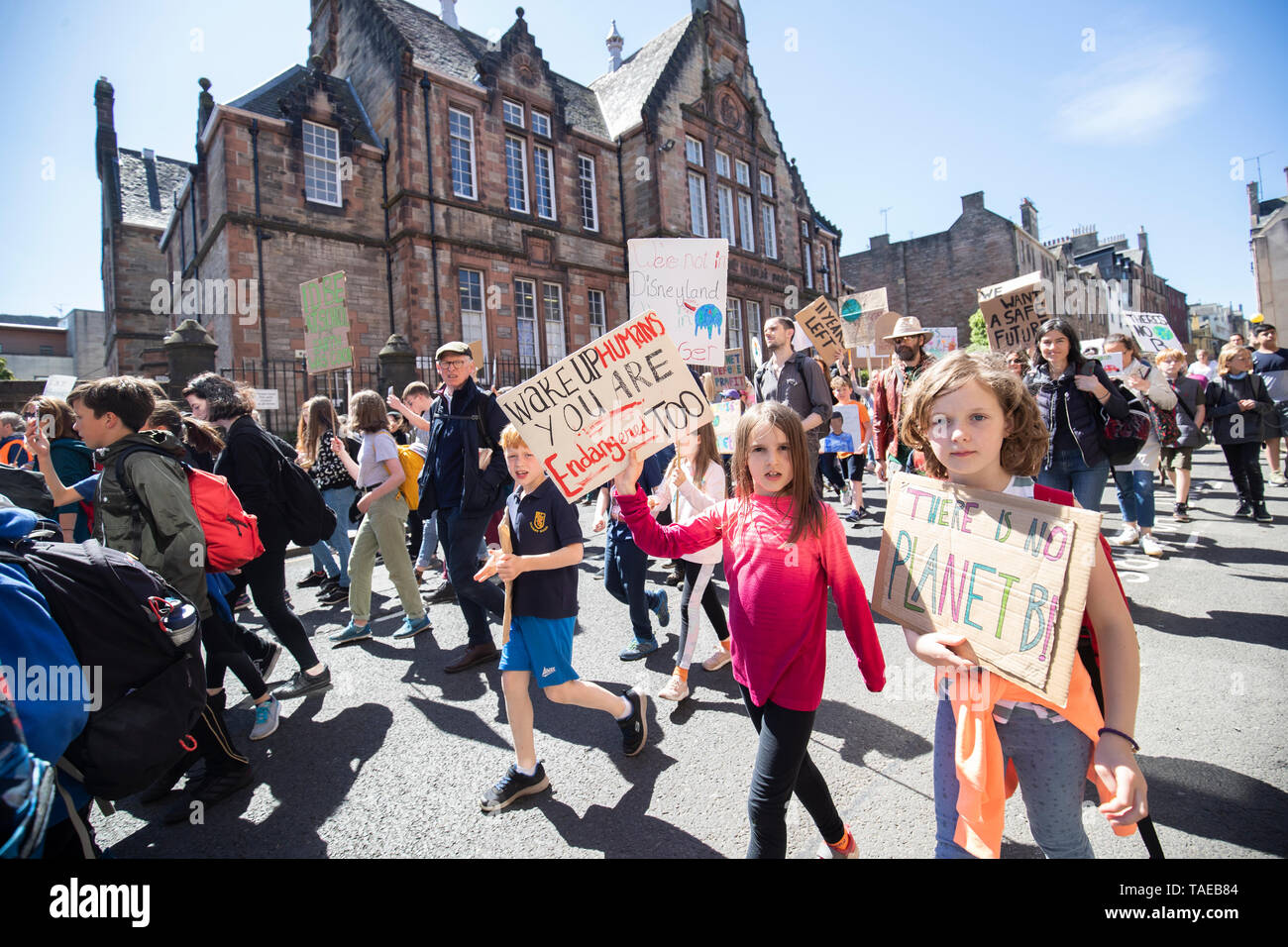 Students take part in the Scottish Youth Climate Strike, in Holyrood, Edinburgh, to demand urgent action to tackle climate change. Stock Photo