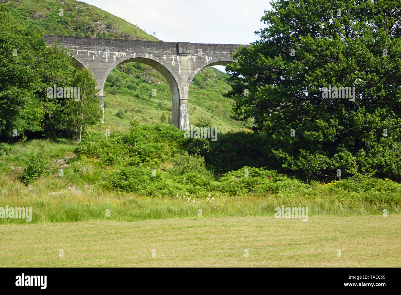 The railroad bridge by the Harry Potter filming celebrity. Over the bridge, the red Hogwarts