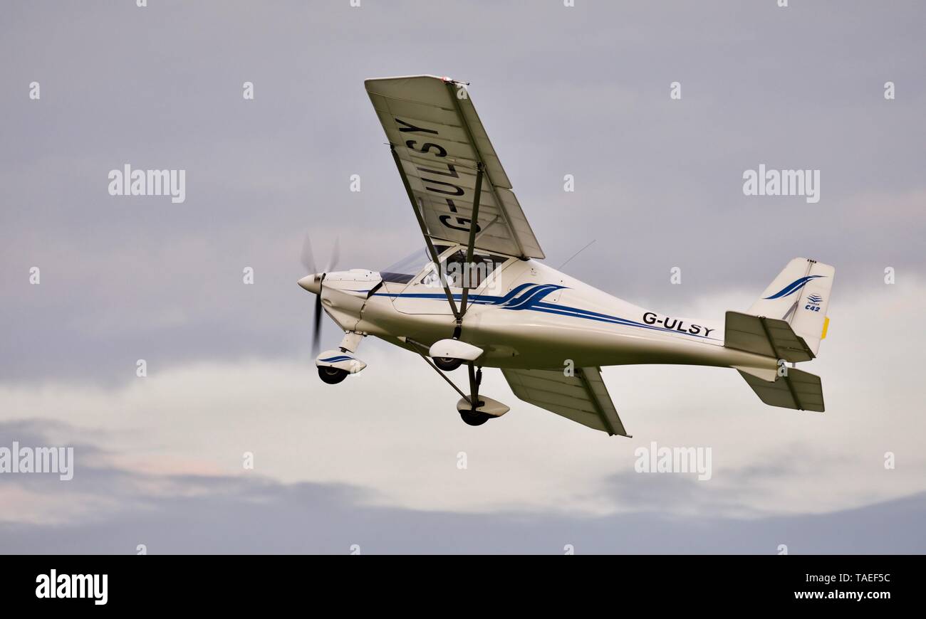 Ikarus C42 “G-ULSY” taking off from Old Warden Aerodrome on the 18th May 2019 Stock Photo