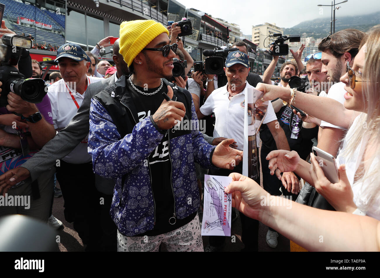 Lewis Hamilton in the pitlane signing autographs during a preview day ...