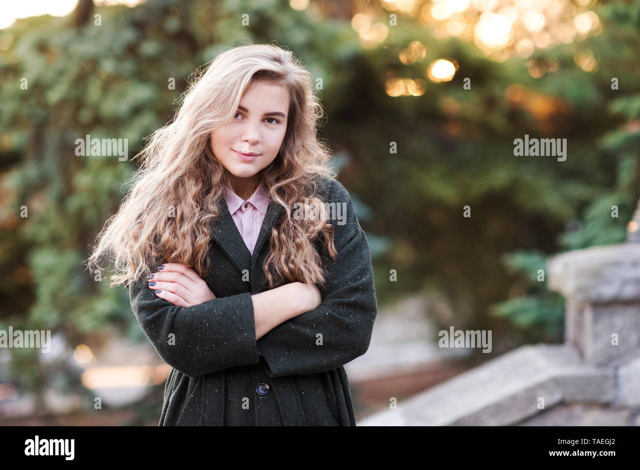 Stylish Blonde Teen Girl 14 16 Year Old Wearing Stylish Jacket Outdoors Over Nature Background 
