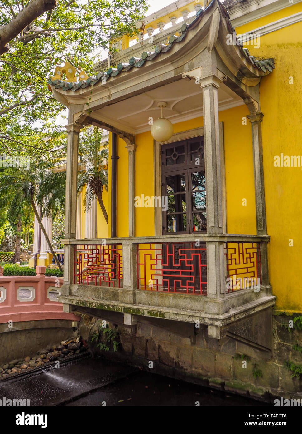 MACAU, CHINA - NOVEMBER 2018: The vibrant yellow Qingcao hall of the Lou Lim Leoc public garden and park Stock Photo