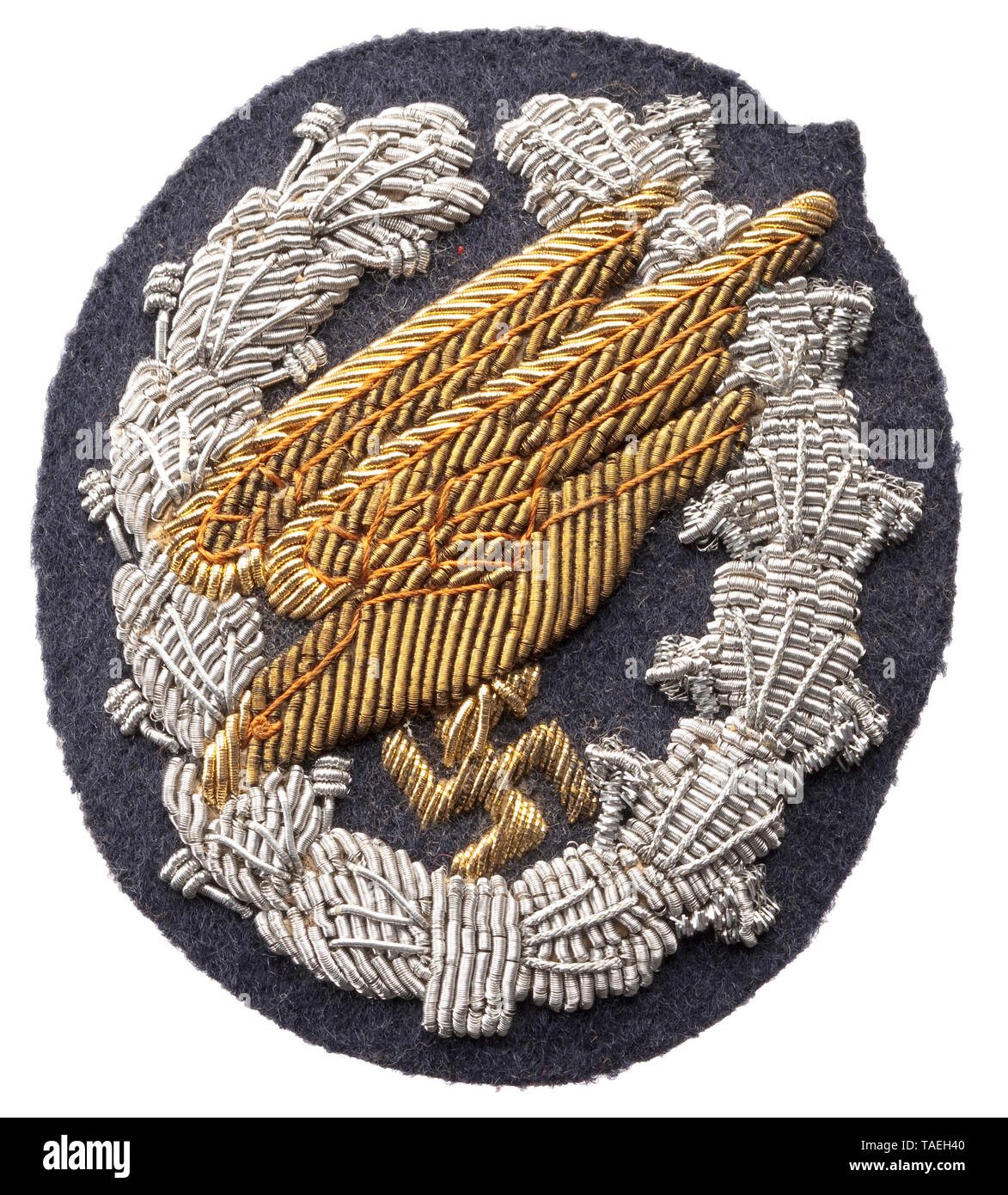 A Luftwaffe Paratrooper Badge embroidered officer quality issue Hand-embroidered with multi-coloured, tinted and gilt tinsel thread on a Luftwaffe-blue base, the reverse with black paper covering. historic, historical, 20th century, Editorial-Use-Only Stock Photo