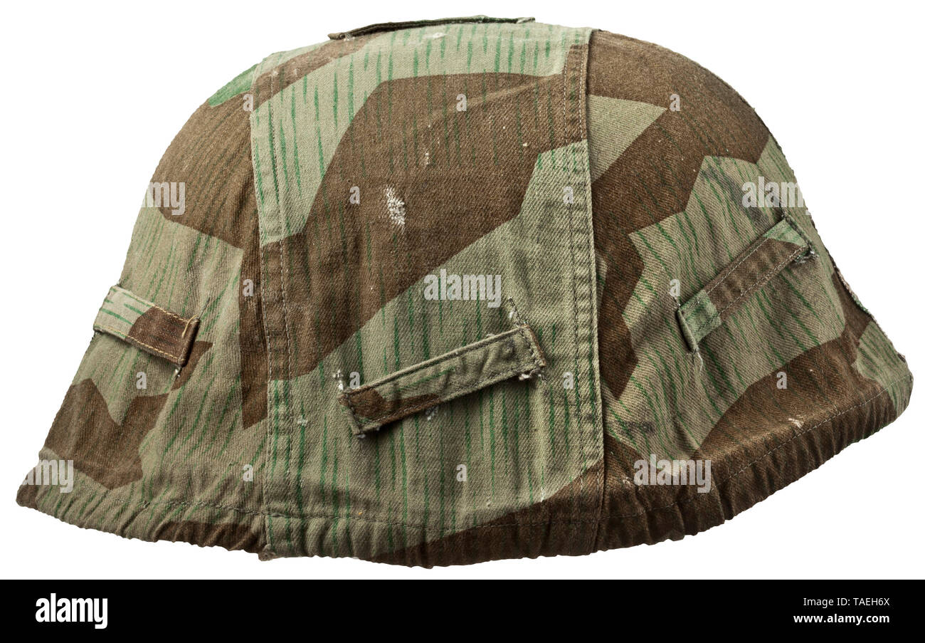 A cover for a steel helmet in splinter camouflage pattern Cover of  imprinted cotton material, splinter pattern camouflage on the exterior,  white interior. The outside with seven separate attachment loops, the strap