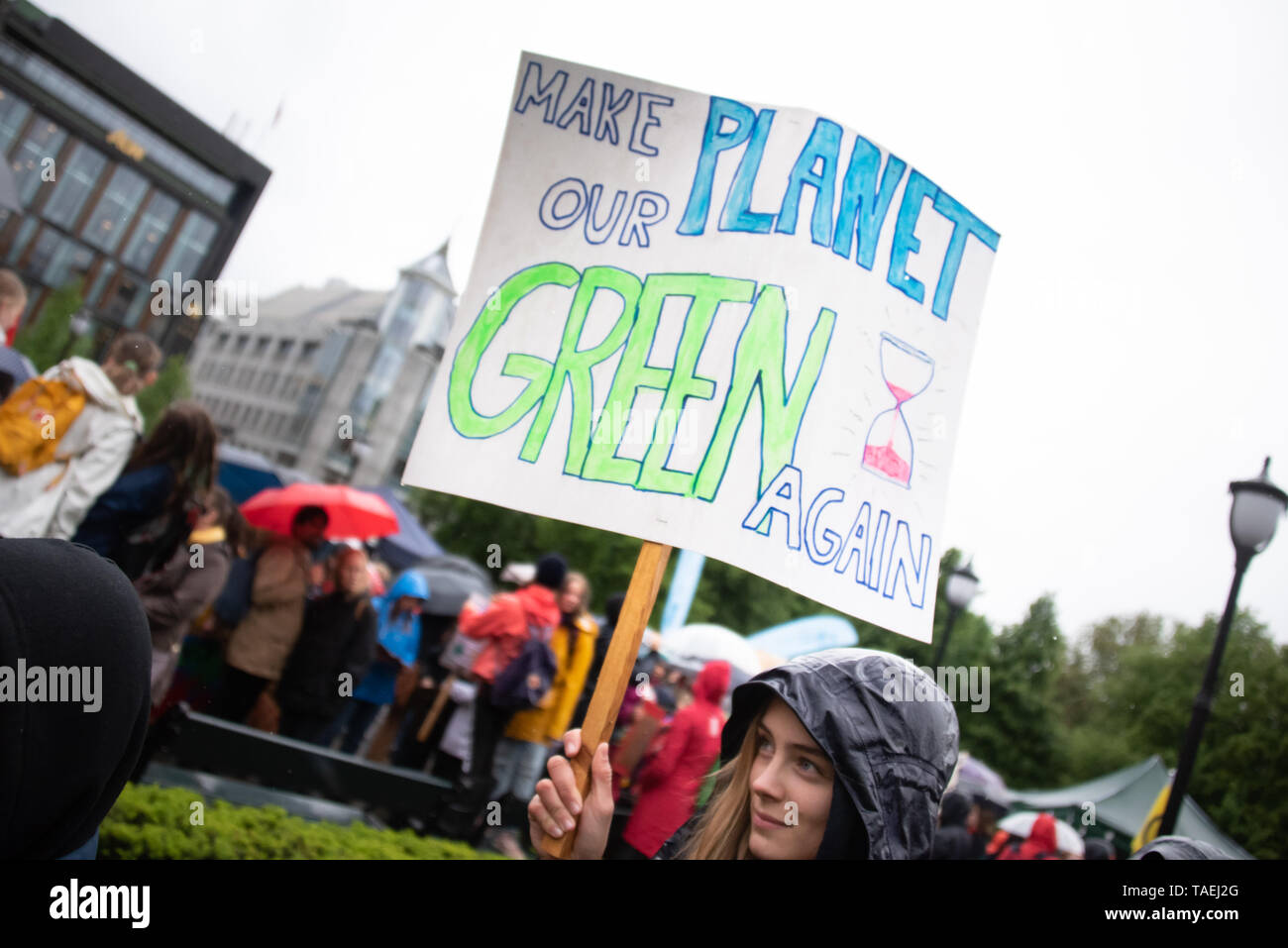 OSLO - MAY 24, 2019: A student carries a sign reading 'Make Our Planet Green Again' as thousands march in the School Strike for the Climate in Oslo, Norway, May 24, 2019. Stock Photo