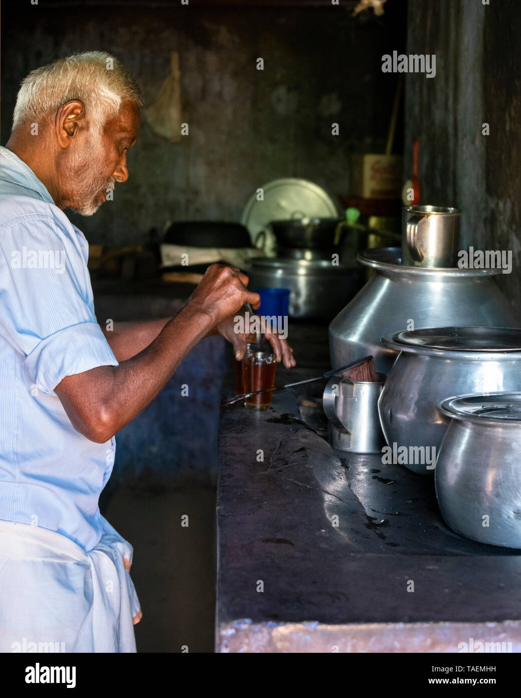 Horizontal Vertical Square view of a man making tea in India. Stock Photo