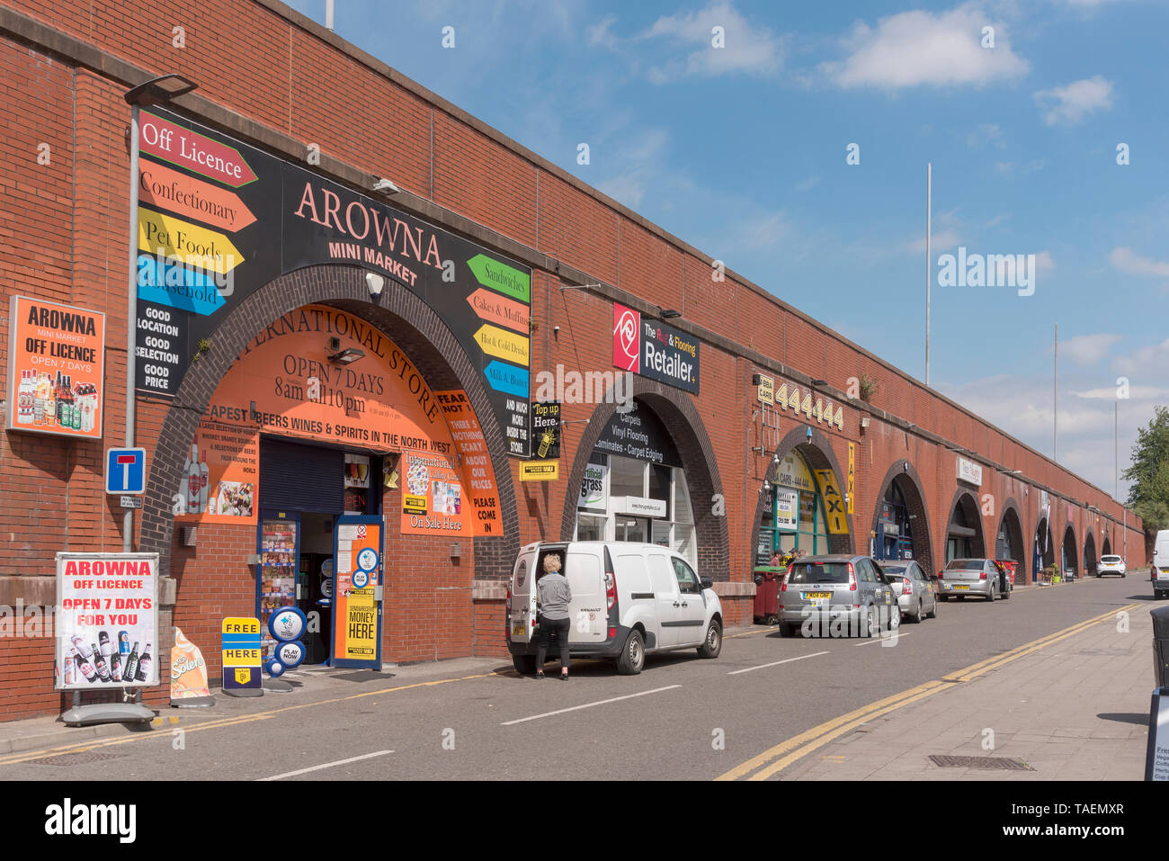 Warrington town centre. Shops under the roadway arches. Stock Photo