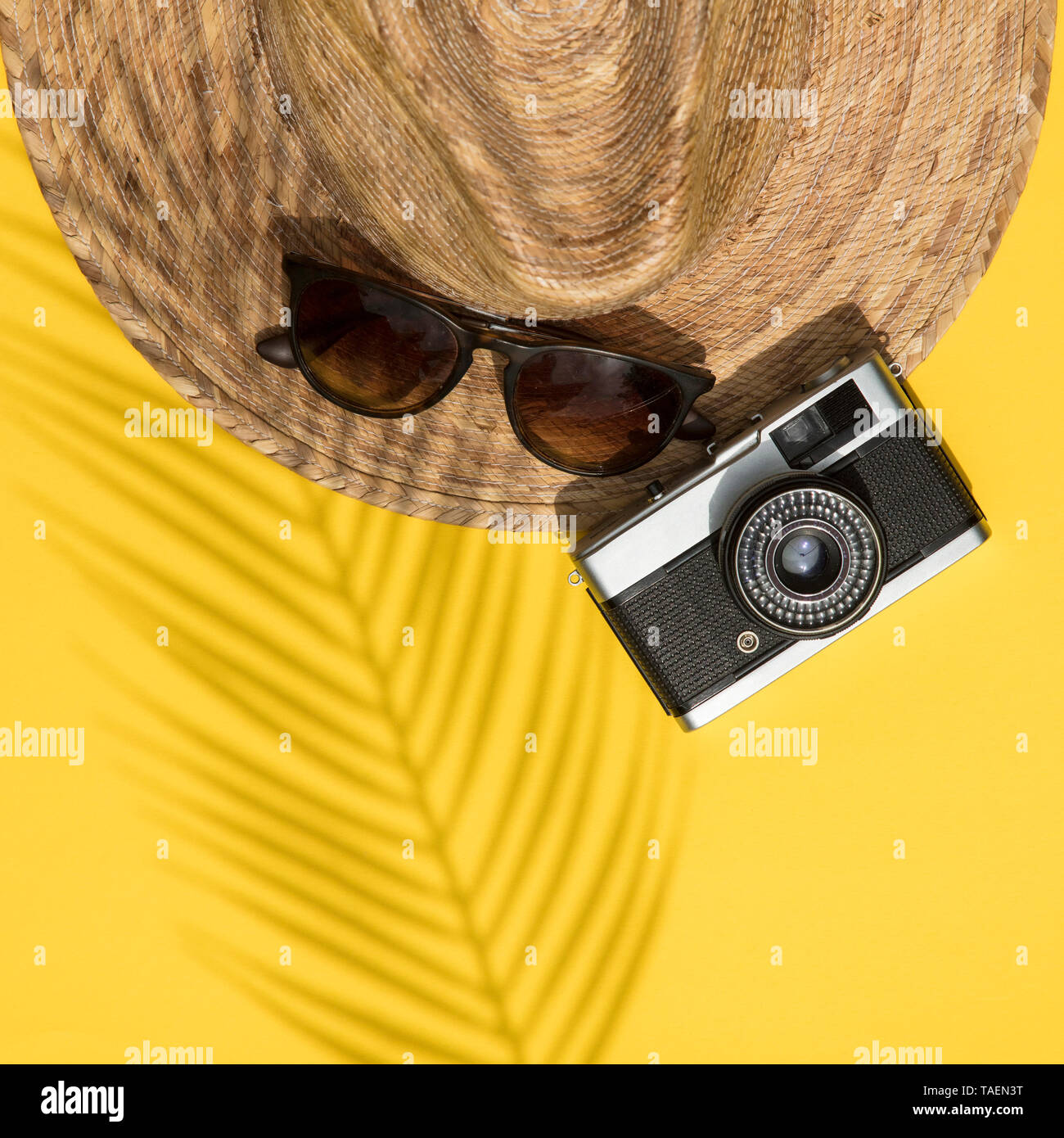 Summer vacation accessories, hat, sunglasses and camera lay flt composition Stock Photo