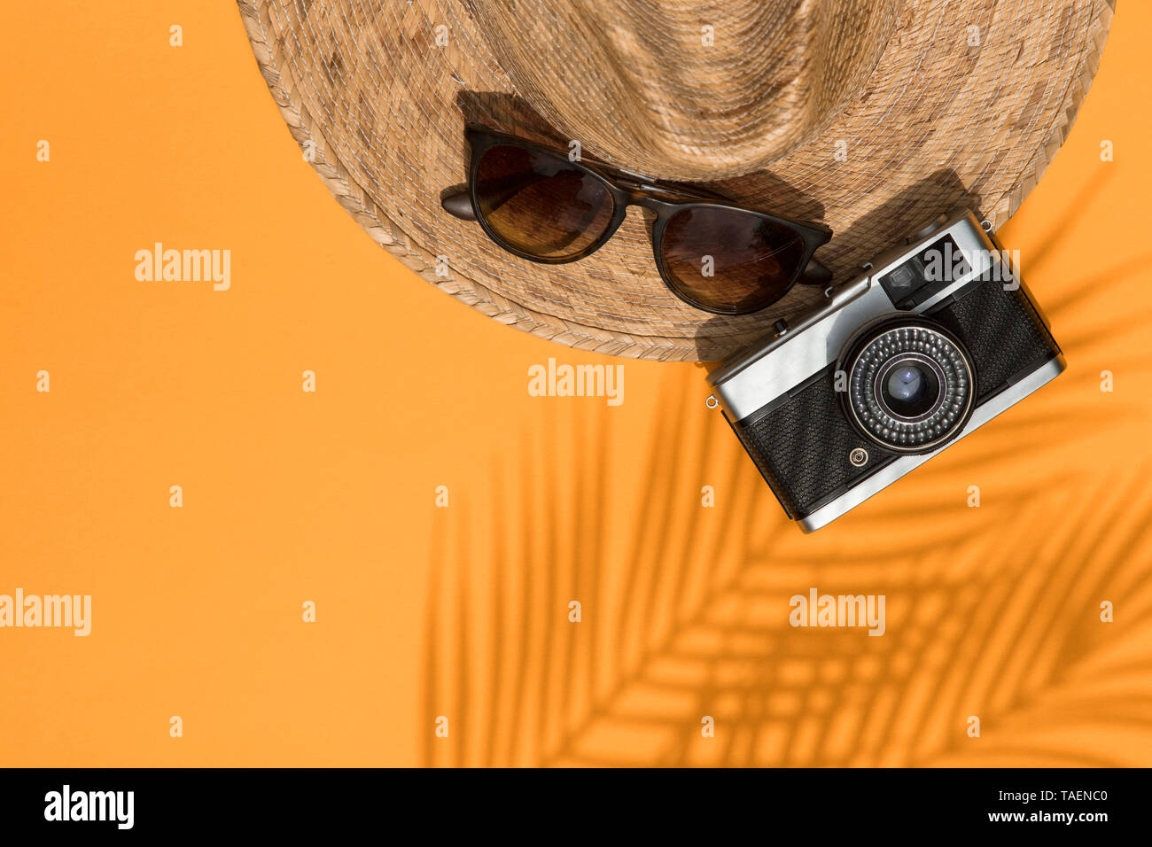 Summer vacation accessories, hat, sunglasses and camera lay flt composition Stock Photo