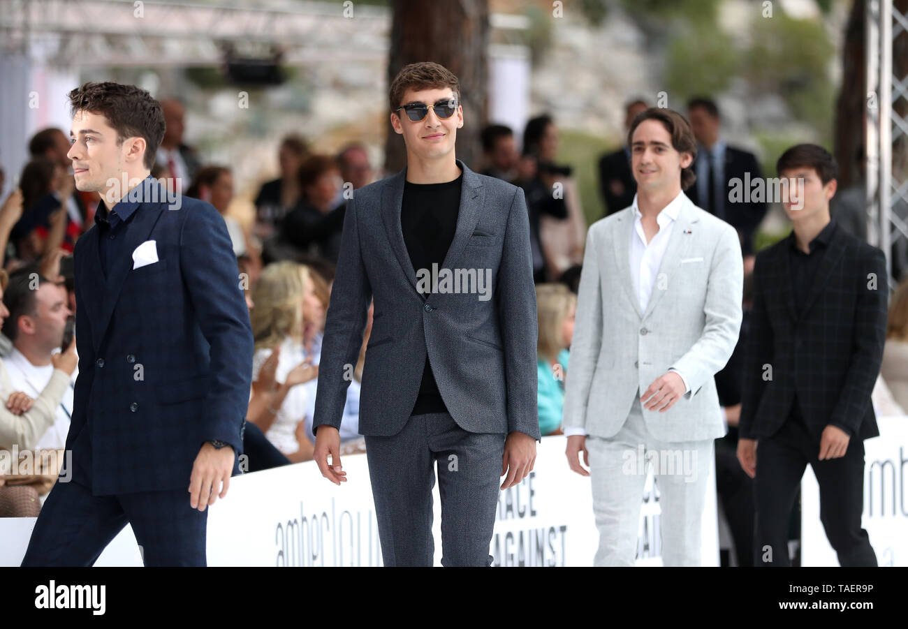 Formula One drivers Charles Leclerc (left), George Russell (centre), and Esteban Ocon (centre right) attending the Amber Lounge Fashion Show 2019, held in Monaco, France. Stock Photo