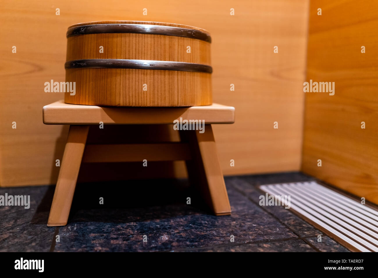Cypress bathtub wooden traditional Japanese tub with water stool in home house or onsen hotel bathroom interior with nobody and in Japan Stock Photo