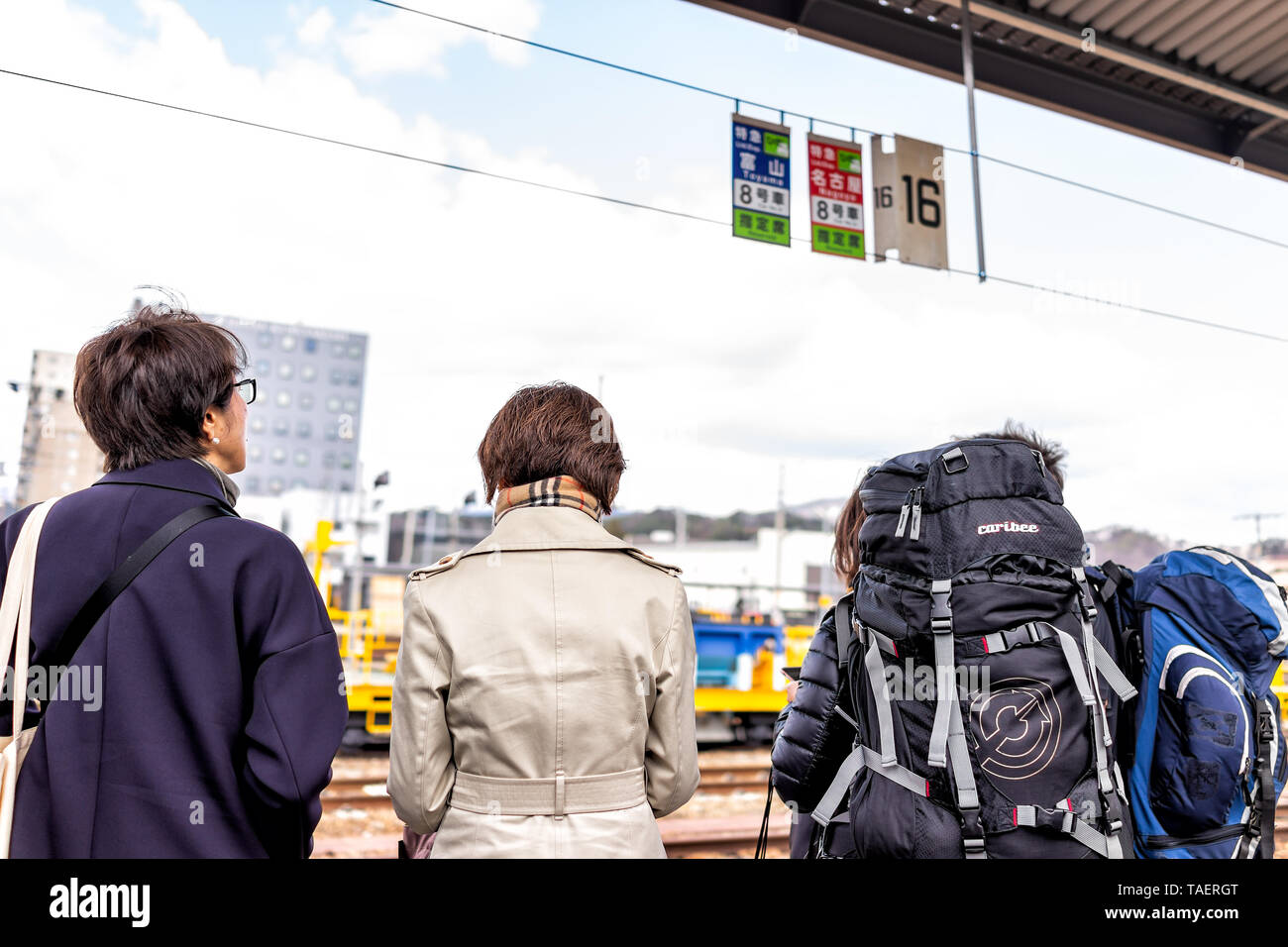Takayama, Japan - April 8, 2019: JR train station platform in Gifu prefecture in Japan with people waiting for Hida shinkansen by car number Stock Photo