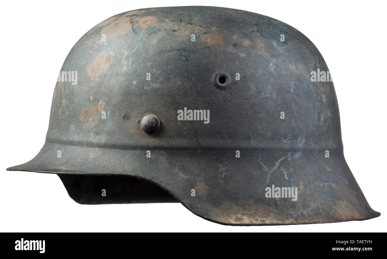 A steel helmet M 45 for Luftwaffe auxiliary personnel Grau lackierte Glocke (leicht flugrostig), vollständiges Innenfutter mit Kinnriemen aus Plastik. historic, historical, Air Force, branch of service, branches of service, armed service, armed services, military, militaria, air forces, object, objects, stills, clipping, clippings, cut out, cut-out, cut-outs, 20th century, Editorial-Use-Only Stock Photo