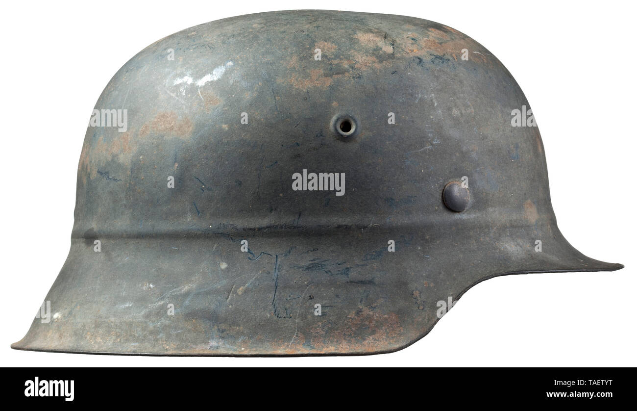 A steel helmet M 45 for Luftwaffe auxiliary personnel Grau lackierte Glocke (leicht flugrostig), vollständiges Innenfutter mit Kinnriemen aus Plastik. historic, historical, Air Force, branch of service, branches of service, armed service, armed services, military, militaria, air forces, object, objects, stills, clipping, clippings, cut out, cut-out, cut-outs, 20th century, Editorial-Use-Only Stock Photo