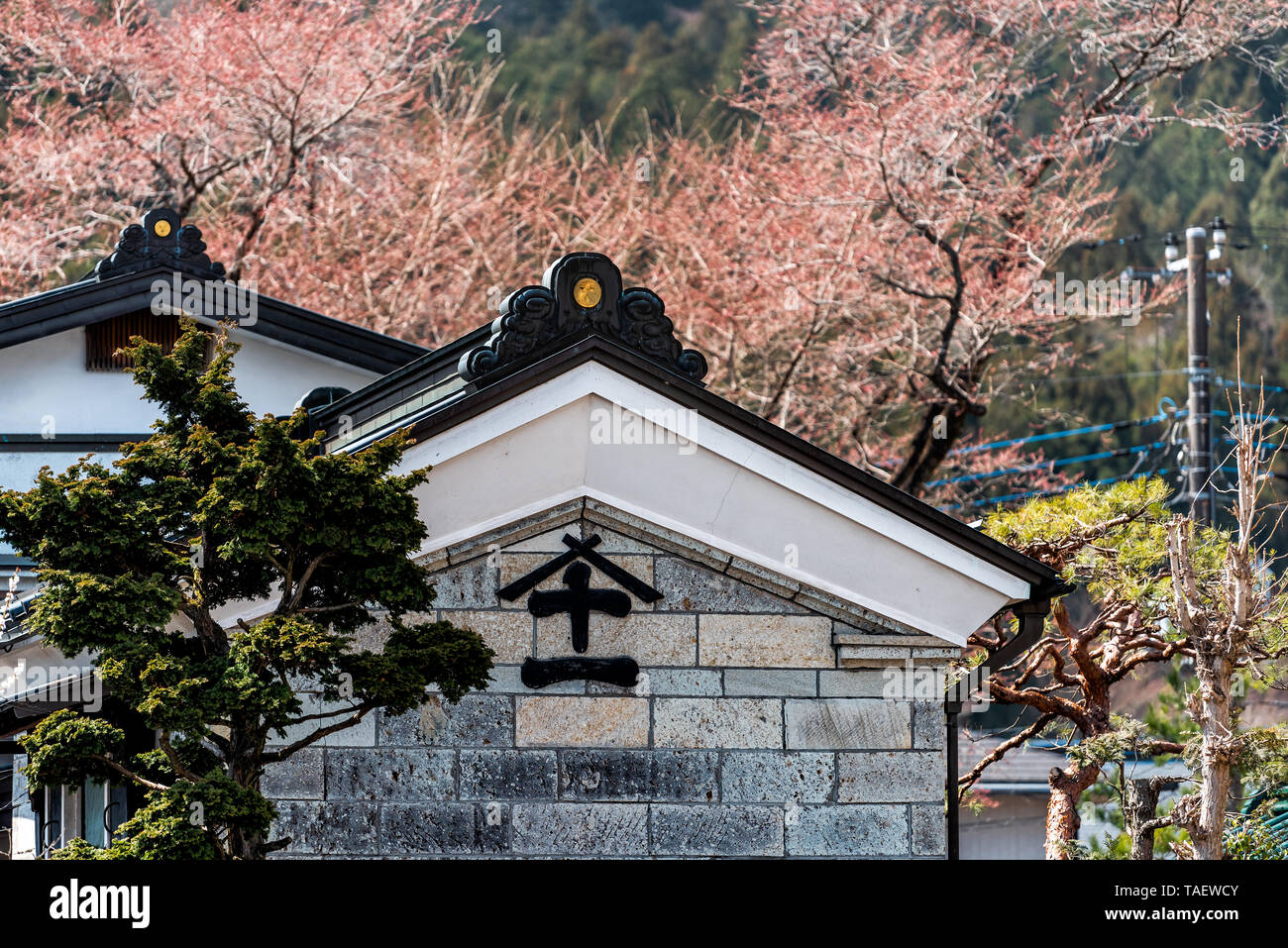 Nikko, Japan - April 4, 2019: Tochigi prefecture village with traditional house building and kanji character sign Stock Photo