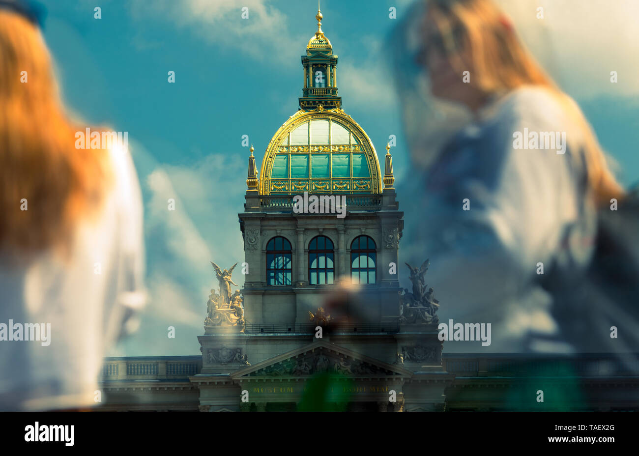 multiple exposures of national museum in prague after reconstruction with silhouettes of people crossing Stock Photo