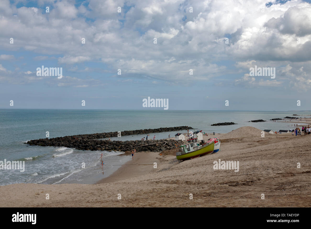 The beach at Lønstrup, Loenstrup,,a popular tourist resort in the north western Jutland, Denmark. Fishing vessels pulled up on the beach. Stock Photo