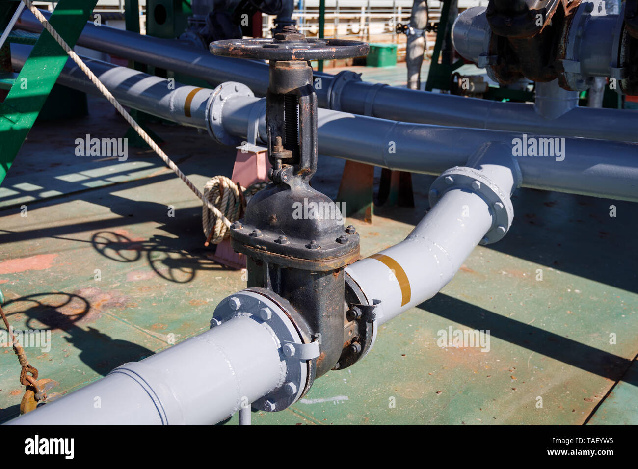 Gate valve and pipelines for loading and discharging liquid cargo on oil-chemical tanker Stock Photo