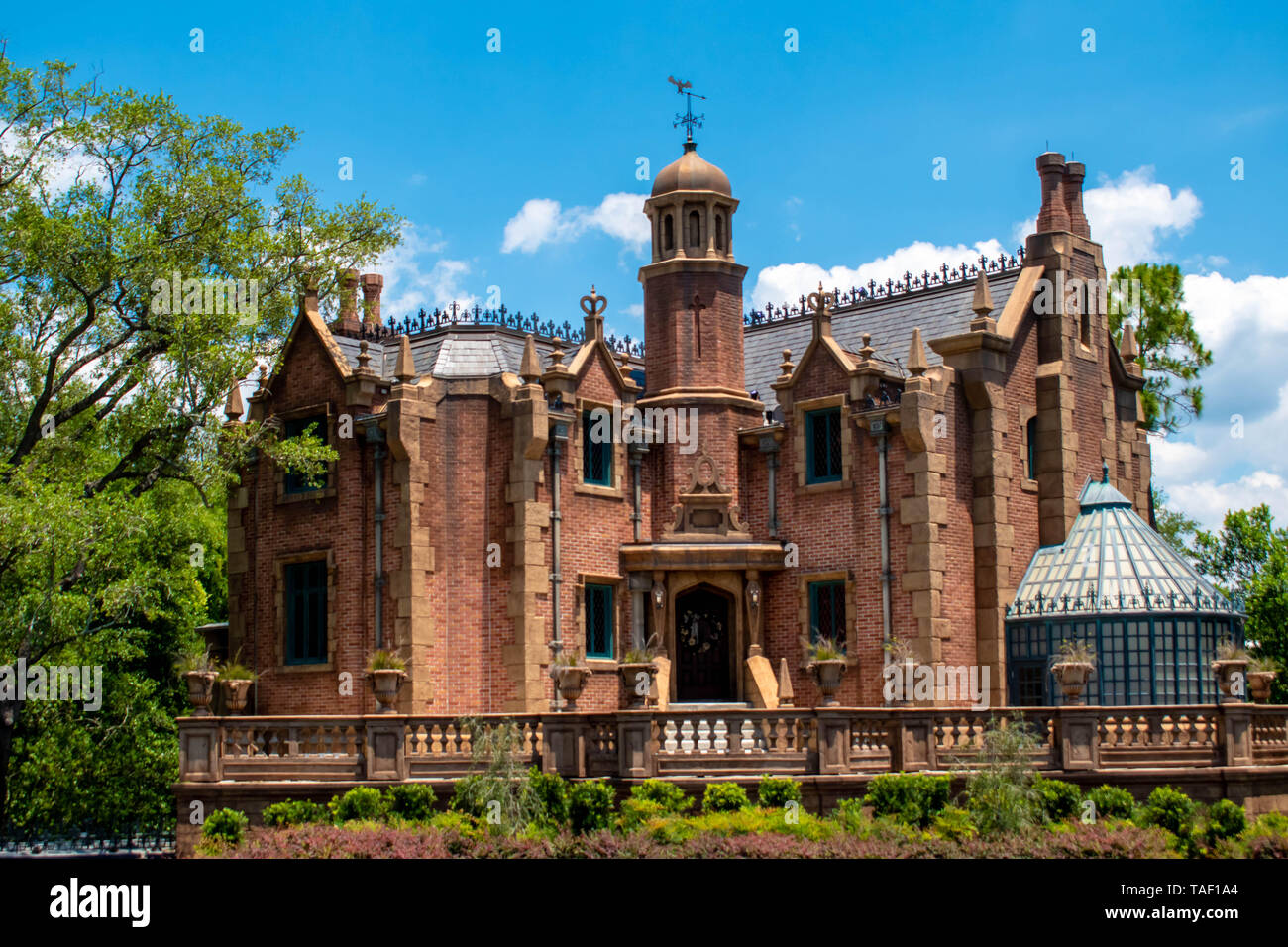 Orlando, Florida. May 16, 2019. Haunted Mansion on lightblue cloudy sky background in Magic Kingdom at Walt Disney World Resort   (2) Stock Photo