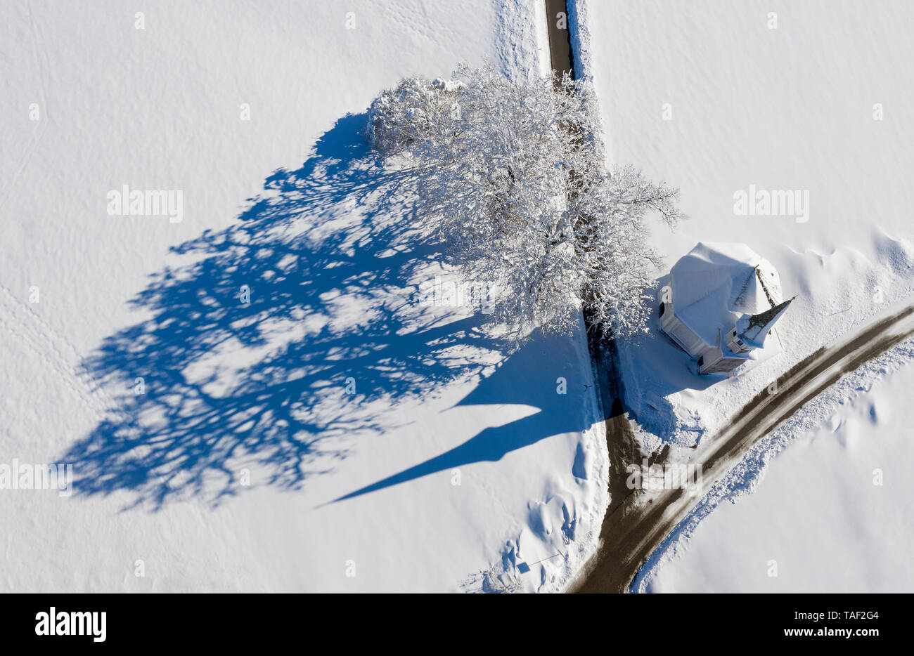 Germany, Upper Bavaria, Harmating, St. Leonhard's chapel in winter, drone view Stock Photo