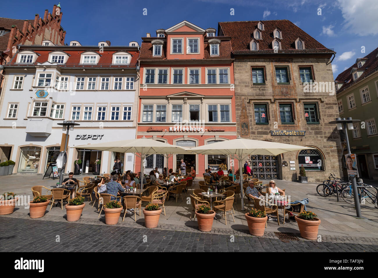 Beautiful facades on historic market square with outdoor café shop in Coburg, Germany Stock Photo