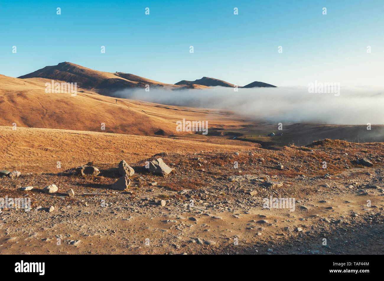 arid landscape with mountain fog Stock Photo