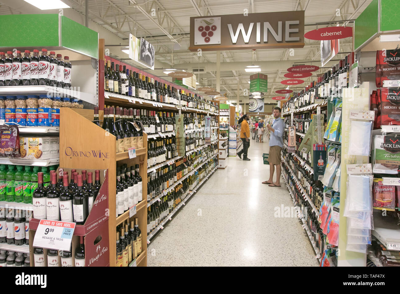 Fort Lauderdale, FL, 5/15/2019: People are shopping at the wine section of a Publix supermarket. Stock Photo