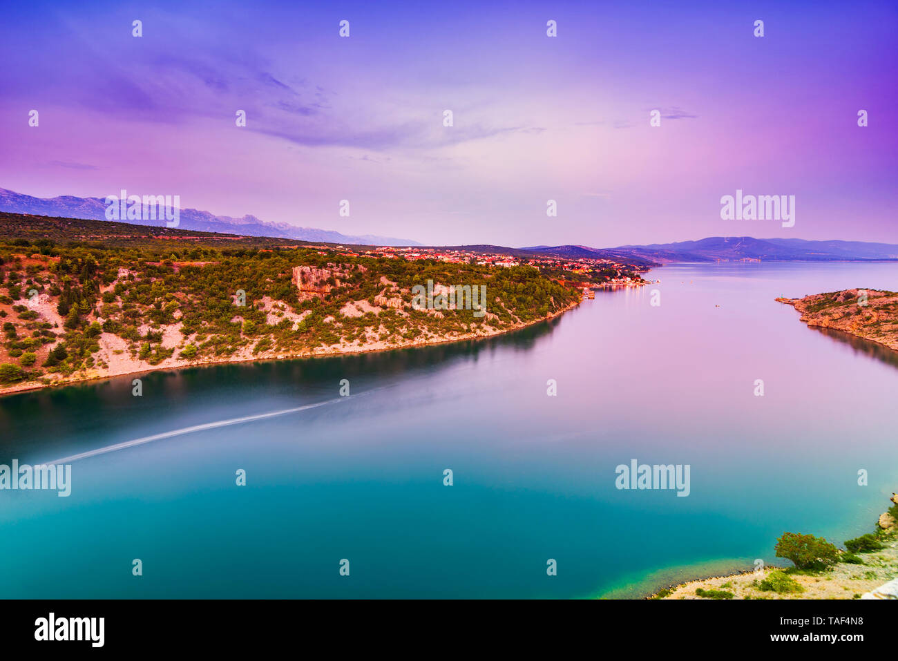 Colorful wide angle scenic view over Novigrad Sea and Maslenica town from Maslenica bridge in Dalmatia, Croatia. Wide angle and long exposure image. Stock Photo