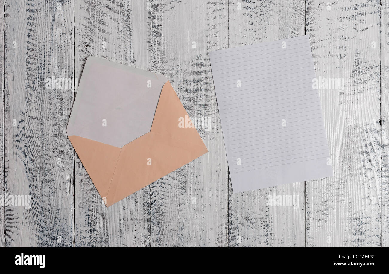 Front view open colored envelope blank sheet letter paper wooden ...