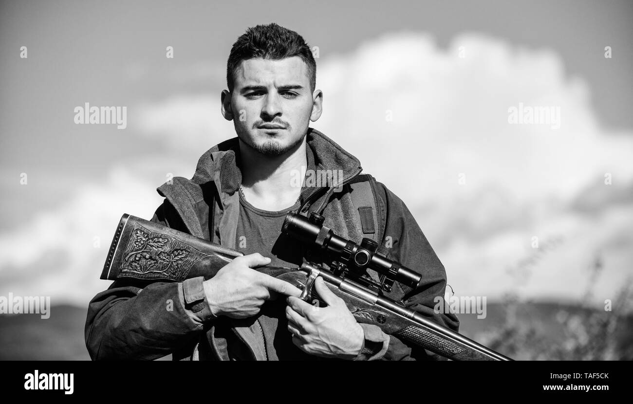 Man with rifle hunting equipment nature background. Make sure safe ...
