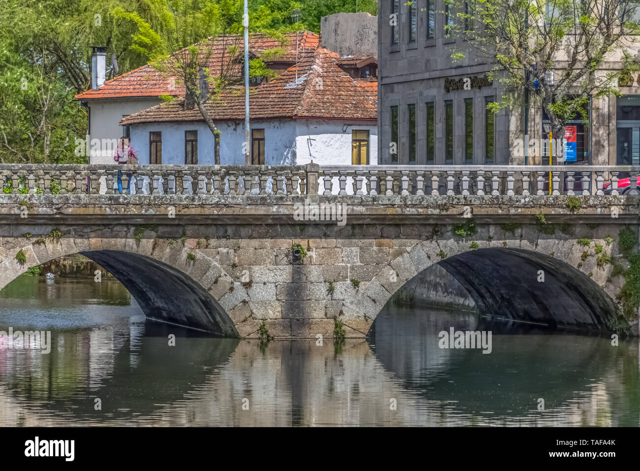 Viseu / Portugal - 04 16 2019 : View of the downtown area of Viseu with Pavia river and banks with buildings, trees and vegetation in Portugal Stock Photo