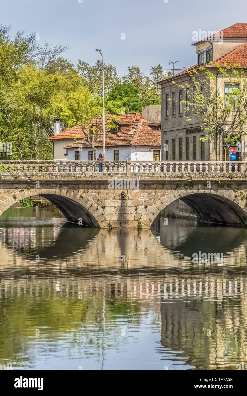 Viseu / Portugal - 04 16 2019 : View of the downtown area of Viseu with Pavia river and banks with buildings, trees and vegetation in Portugal Stock Photo