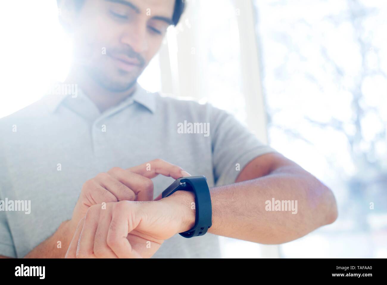 Man checking his smart watch Stock Photo