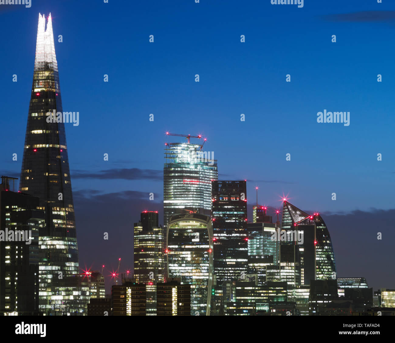 High up view of London city skyline  illuminated at dusk Stock Photo