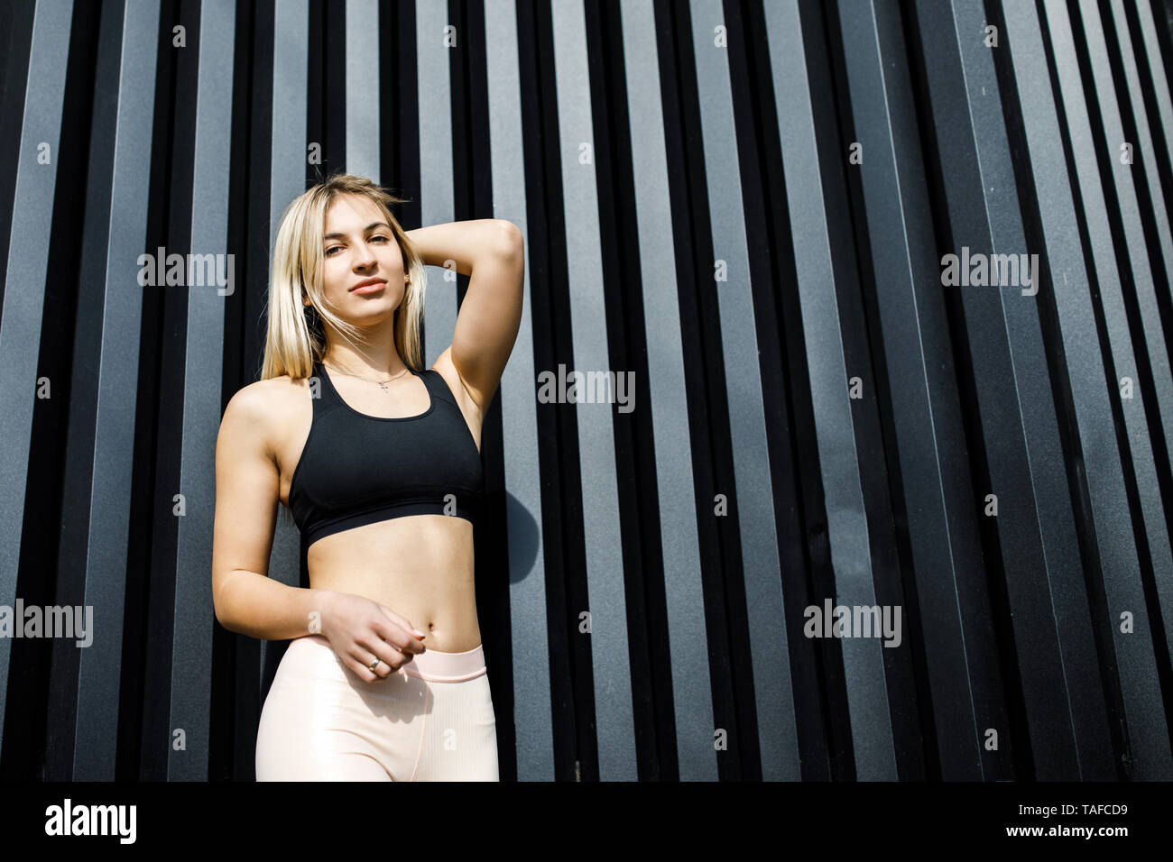Young Blonde in Sports Bra Stock Photo by ©eugenef 95155772
