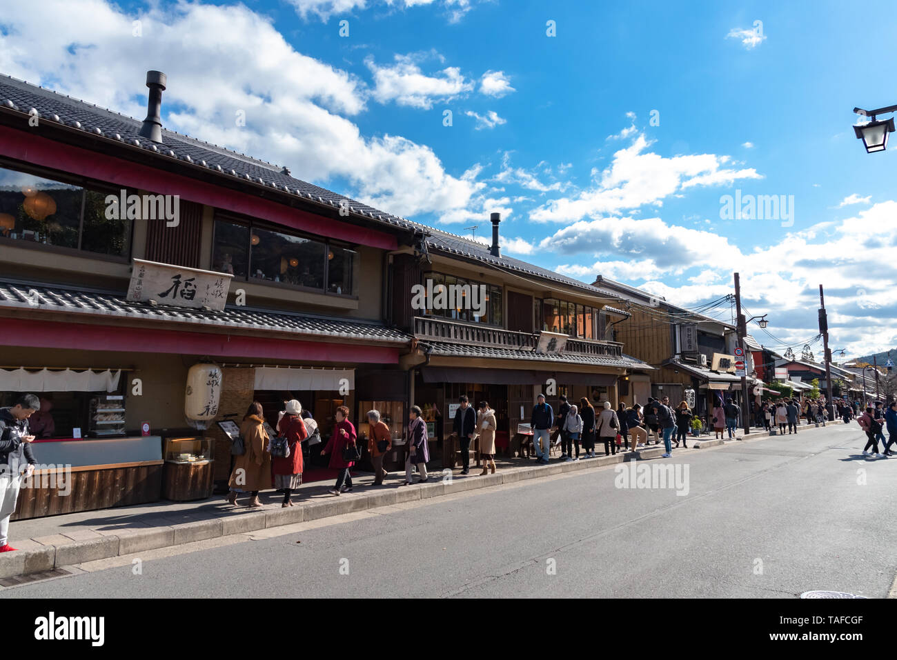 Aera of Togetsu-kyo bridge at Arashiyama district. Many local traditional souvenir shops and crowded tourists in the main street. Kyoto, Japan Stock Photo