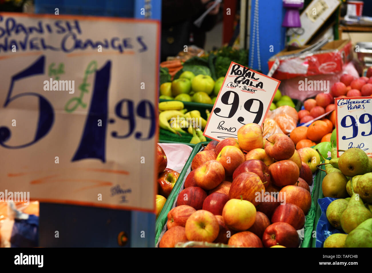 Fruit on sale at a market stall with price tags Stock Photo